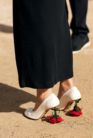 a street style photo from Loewe's spring 2025 runway show