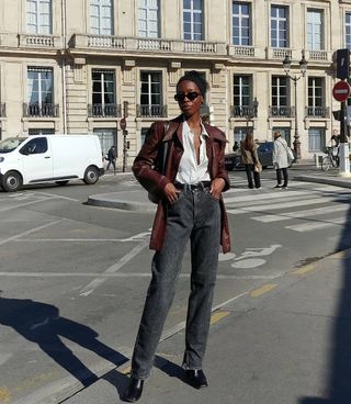 French fashion influencer Sylvie Mus wearing a chic fall outfit with black jeans in Paris.