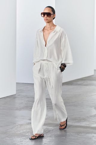 Oversized jacquard shirt and pants in white on model.