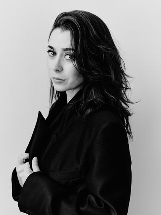 Cristin Milioti wears a black coat.