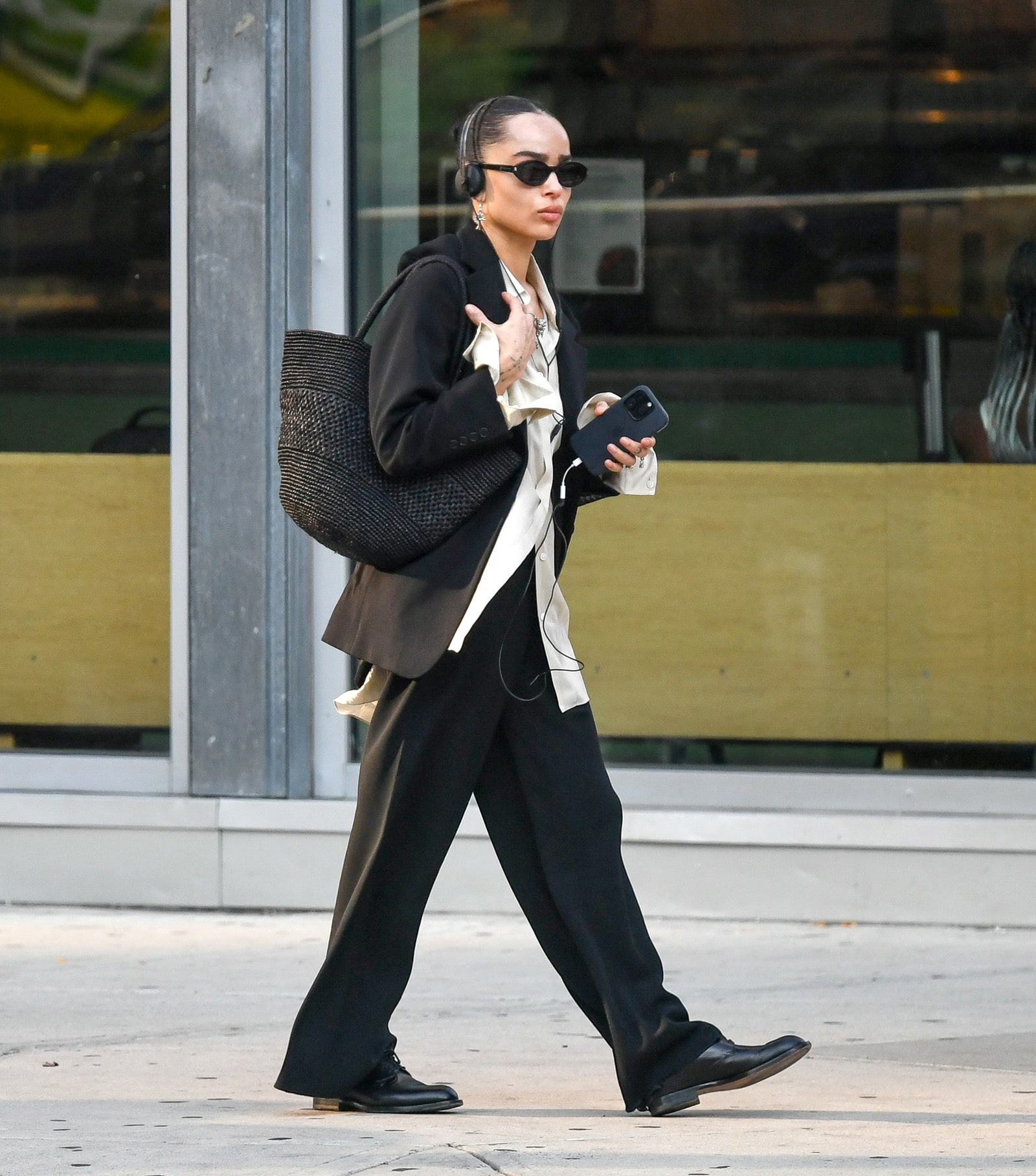 Image may contain Zoë Kravitz Pedestrian Person Clothing Footwear Shoe Accessories Bag Handbag and Formal Wear