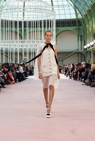 A model walking in the spring summer 2025 Chanel show at the Grand Palais during Paris Fashion Week.