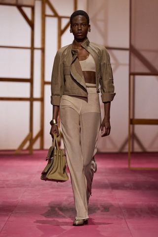 an Hermes model walks the spring/summer 2025 runway