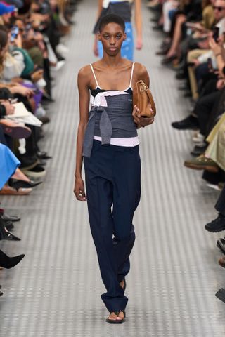 A model walking the runway at Miu Miu's Spring/Summer 2025 Paris Fashion Week show.