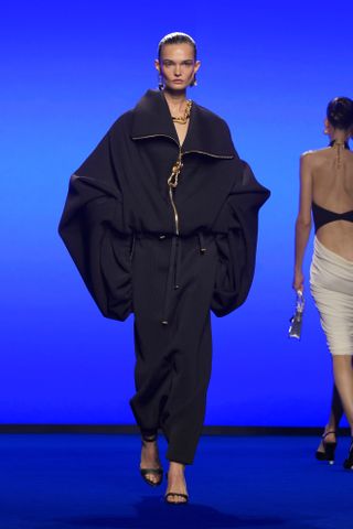 zip-up oversized black top and trousers at schiaparelli at paris fashion week spring summer 2025