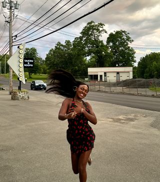 Woman wearing a floral print midi dress.