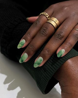 Jade green nail art.