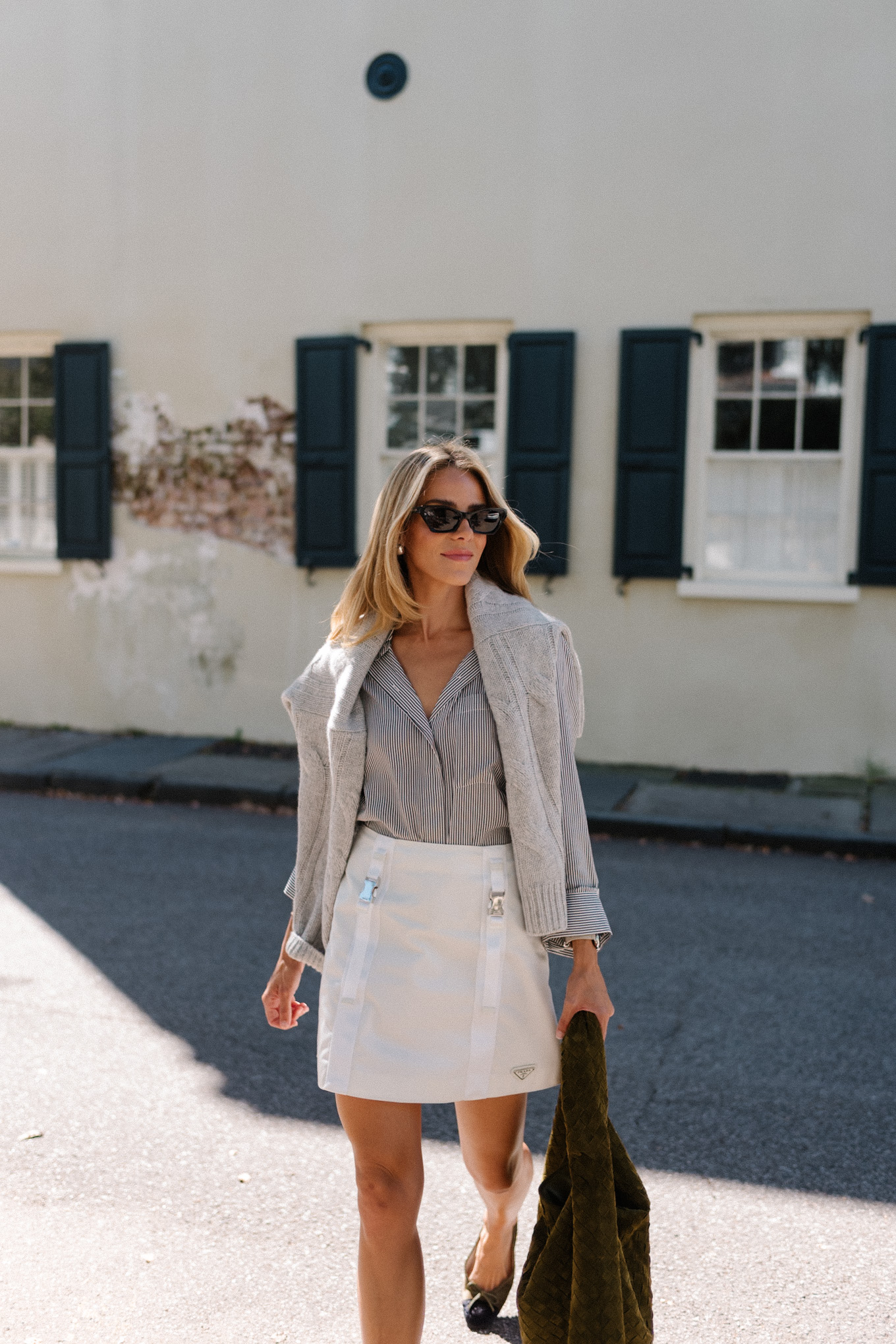 grey sweater striped button down white mini skirt suede hobo bag