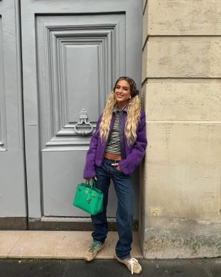 Emili Sindlev wearing suede Miu Miu x NB sneakers