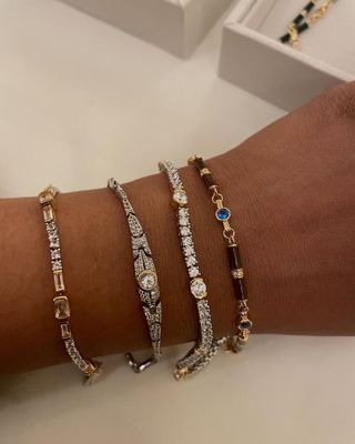 Chiara Perera wears a stack of refined bracelet