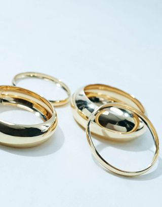 Asos Design Pack of 4 Bangle Bracelets in Mixed Design in Gold Tone