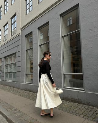 @annabelrosendahl wearing slingback heels with skirt and top