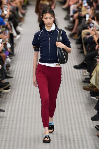 Red leggings on the S/S 25 Miu Miu runway