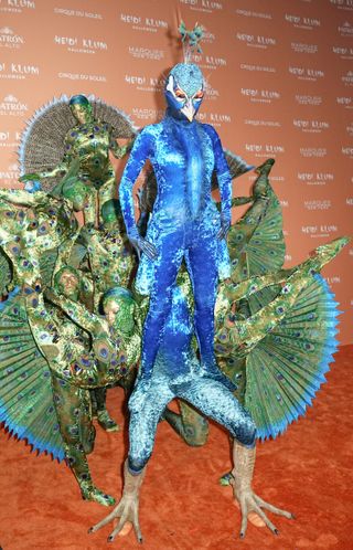 Heidi Klum dressed up for Halloween in an elaborate peacock costume in 2023