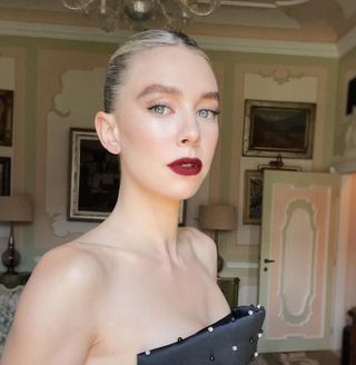 Vanessa Kirby wearing deep berry wine red lipstick