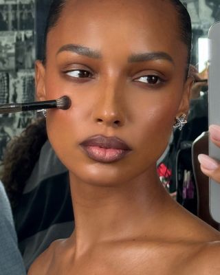 Jasmine Tookes wearing mauve lipstick