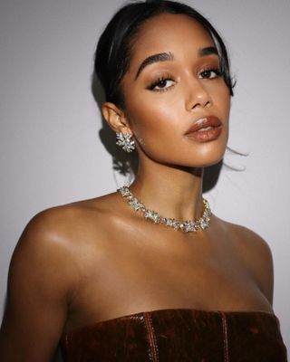 Laura Harrier wearing brown lipstick