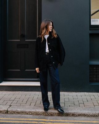 Dark navy blue jeans and black shacket on Kim