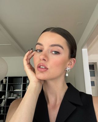 Content creator Mary L Jean poses with a natural makeup look created with Chanel Beauty