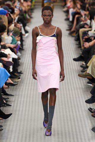 Spring/summer 2025 runway look featuring the powder pink color trend.