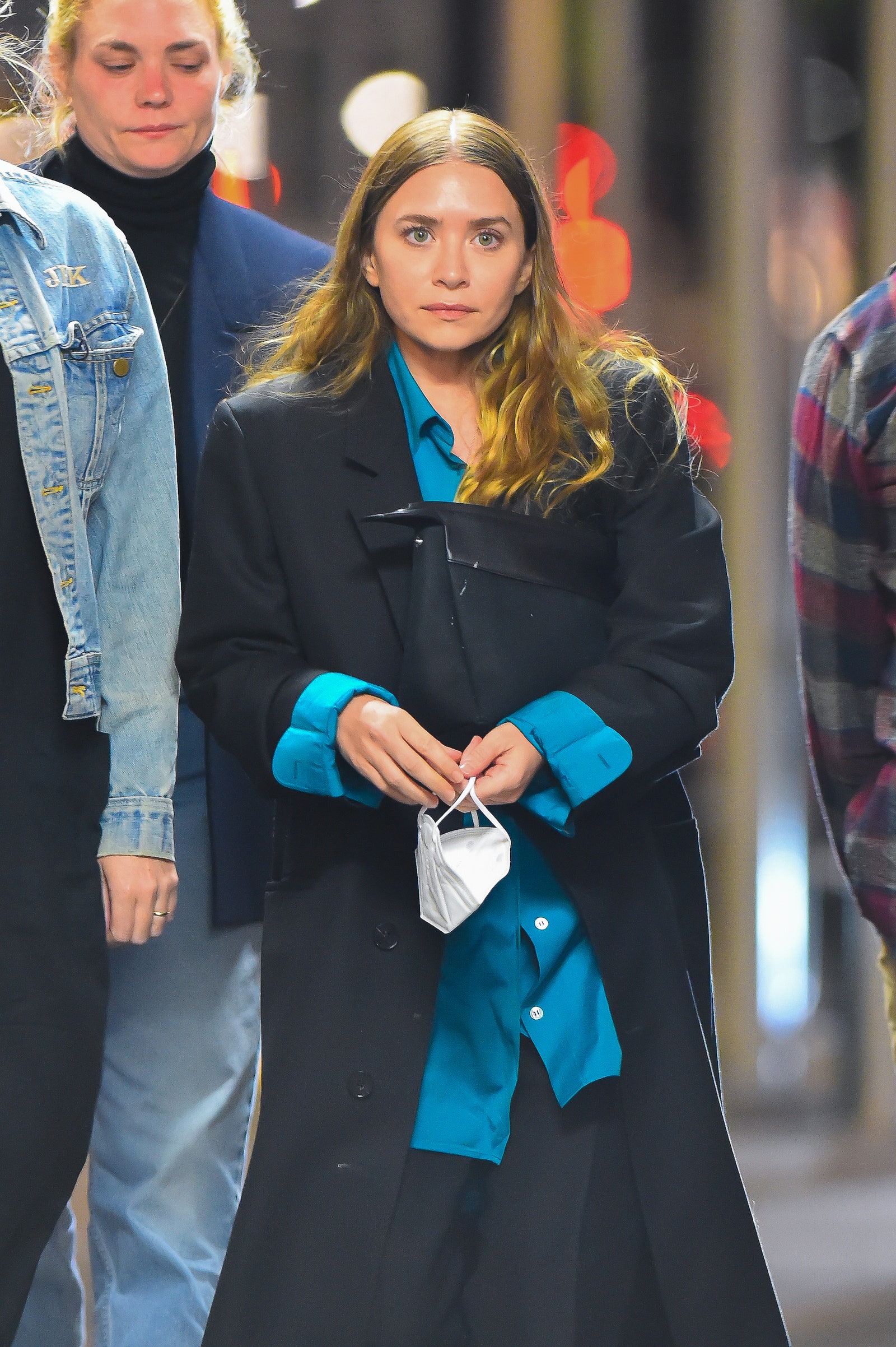 Image may contain Ashley Olsen Clothing Coat Blazer Jacket Adult Person Formal Wear Suit Accessories and Bag