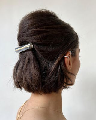 French bun hairstyle with barette