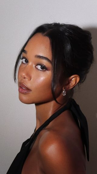 Laura Harrier with French bun hairstyle