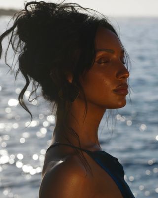 Jasmine Tookes with French bun hairstyle