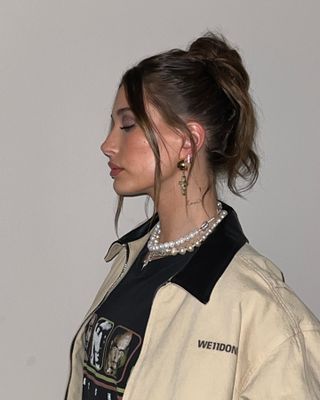 Hailey Bieber with French bun hairstyle