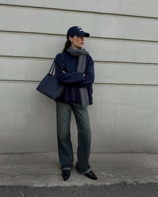 Influencer wears a navy winter outfit