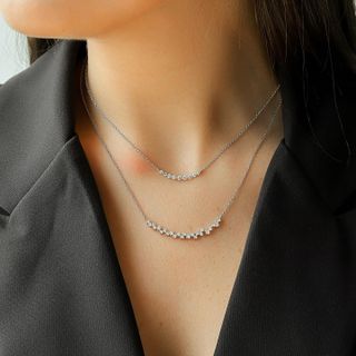 Woman wearing double chain diamond necklace