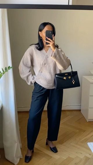 Influencer wears an asymmetric cardigan