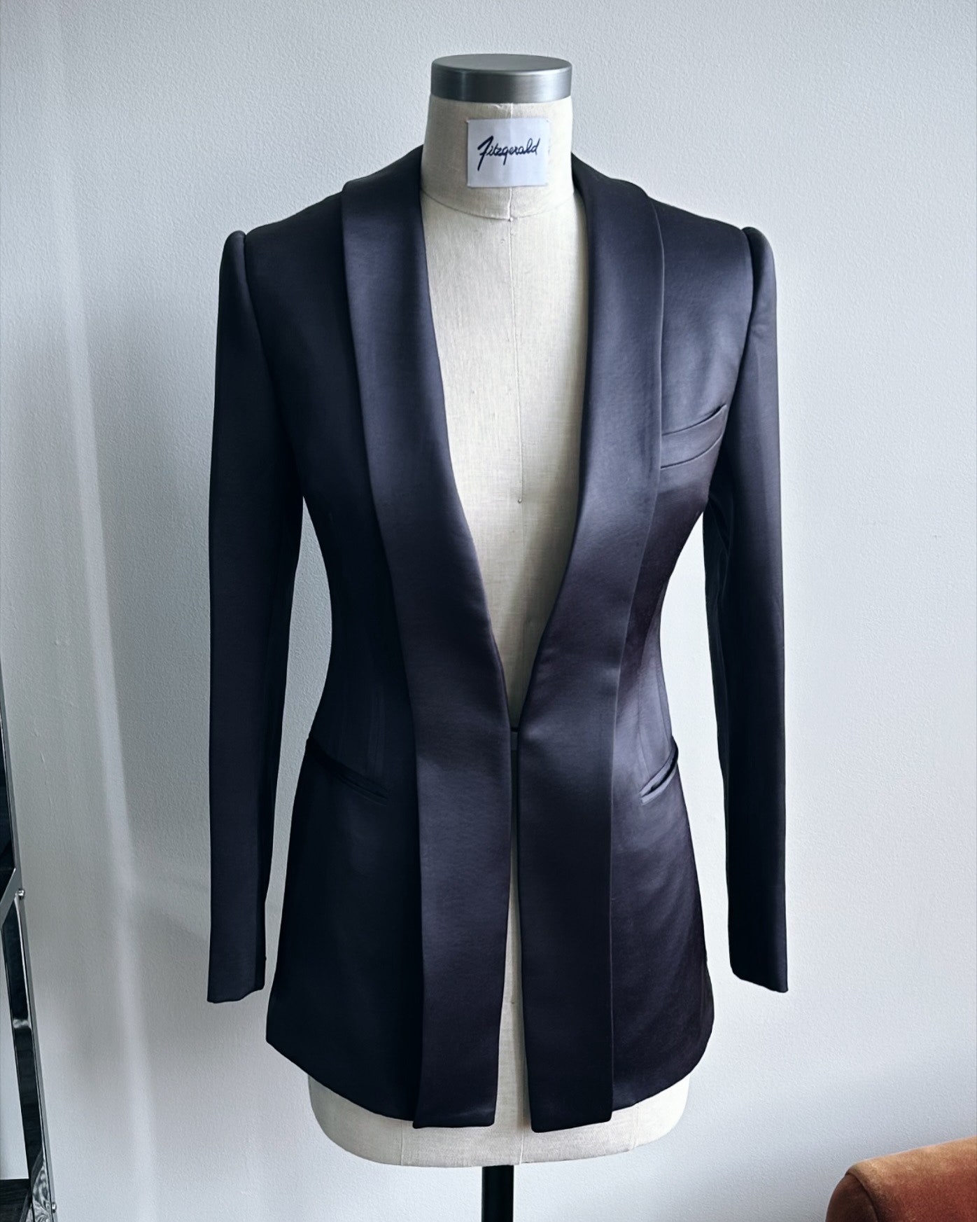 Image may contain Blazer Clothing Coat Jacket Formal Wear Suit and Tuxedo