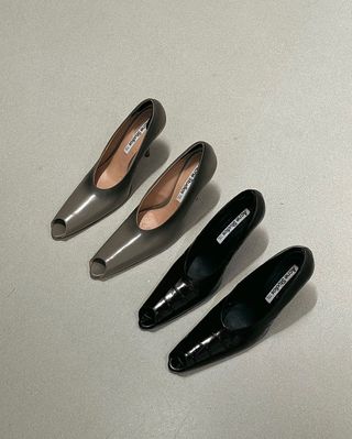 two pairs of grey and black peep-toe pumps from Acne Studios' spring 2025 collection