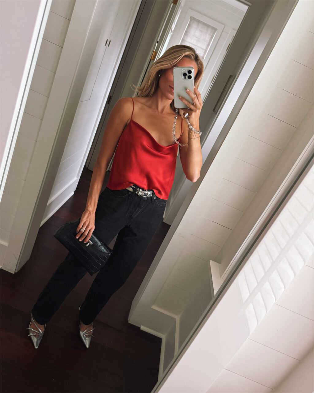 red silk tank snakeskin belt black pants silver pumps