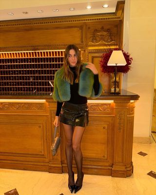 @camillecharriere wearing a mini skirt and top