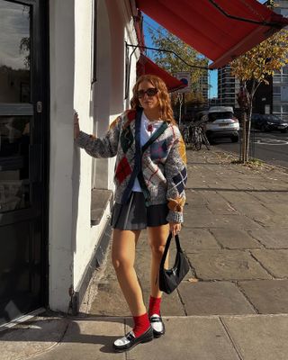 Influencer wears an argyle knit