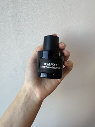 Jamie Schneider testing Tom Ford perfume