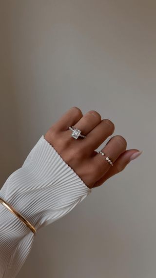 Woman wearing engagement ring from James Allen.