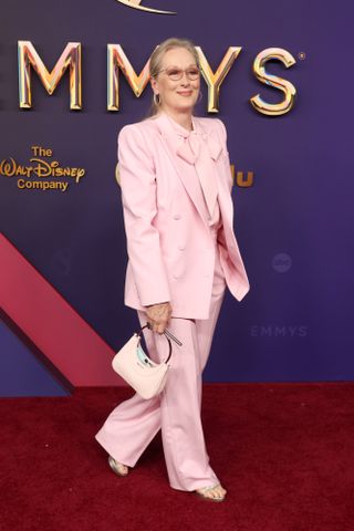 Meryl Streep wears powder pink.