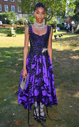 Jennifer Malengele attends the Mithridate SS24 show during London Fashion Week wearing a sugilite purple dress.