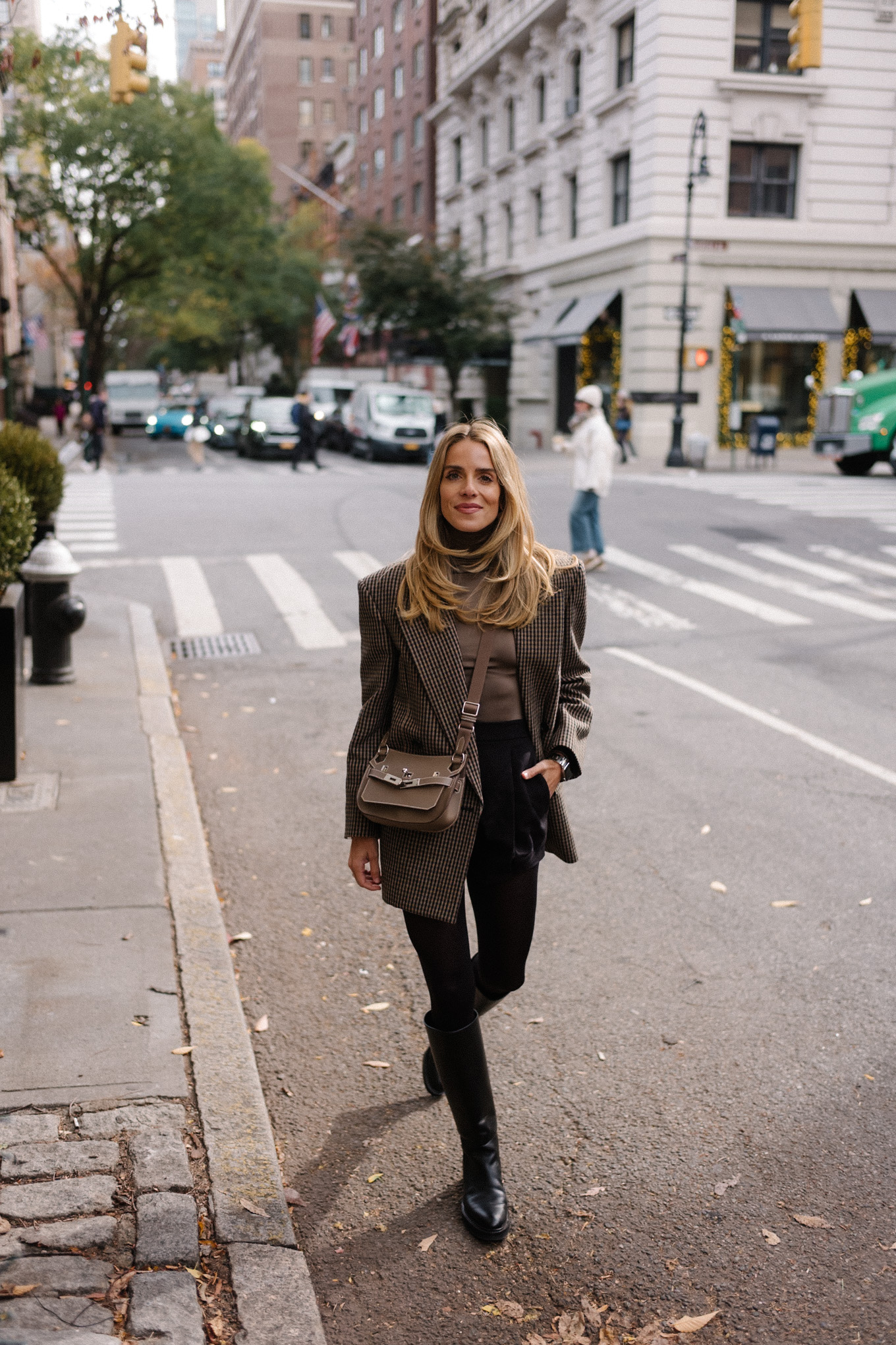 checked wool blazer green turtleneck black skirt black boots silver bag