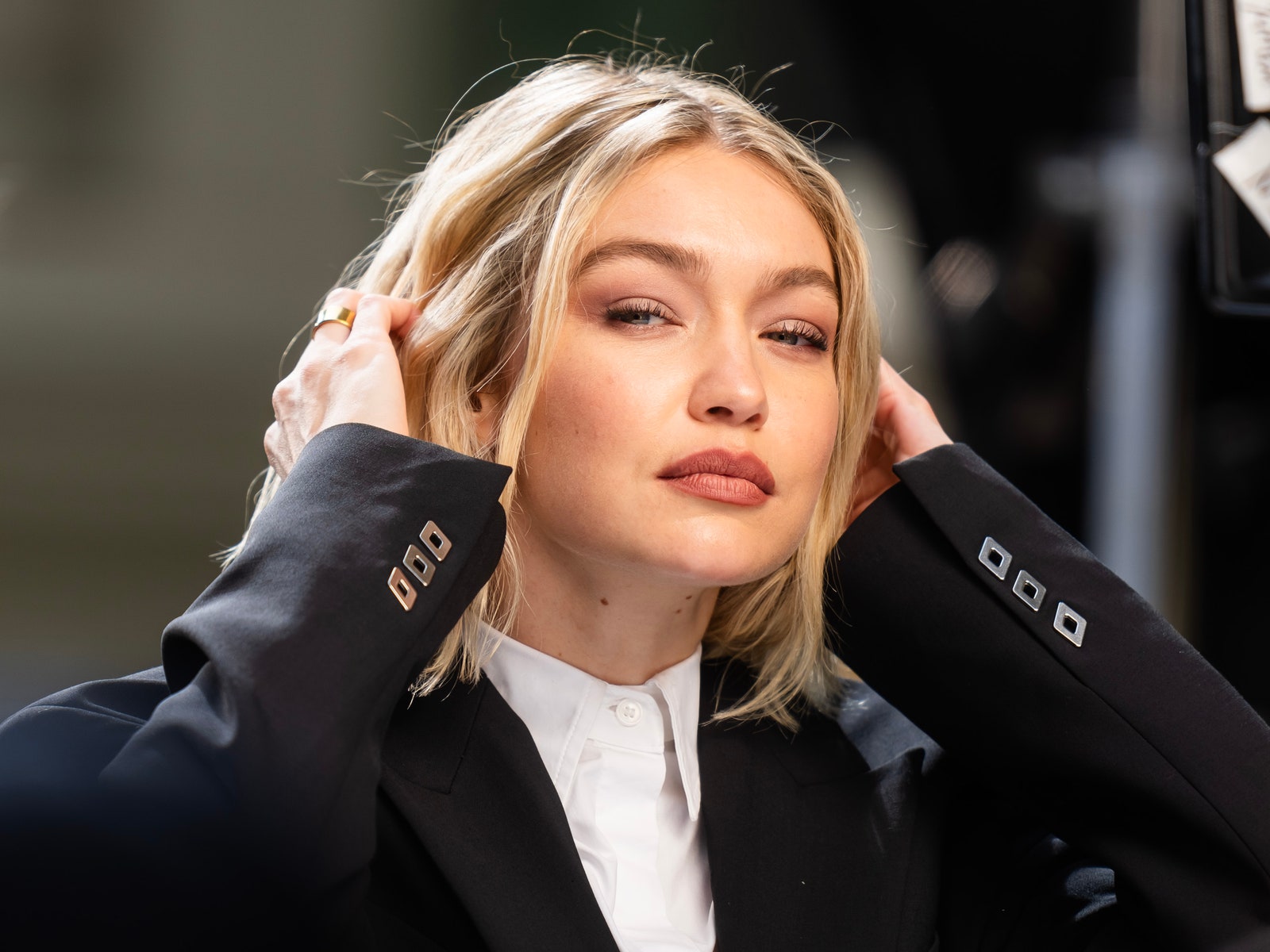 Image may contain Gigi Hadid Blonde Hair Person Adult Head Face Accessories Jewelry and Ring