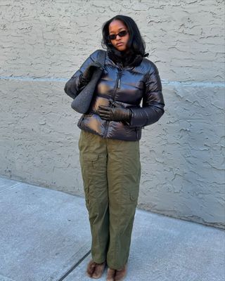 @champagnemani wearing cargo pants and puffer jacket