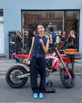 Influencer wears colourful trainers.