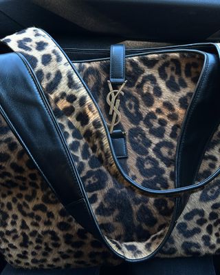 An up close photo of Jeanette Madsen's leopard print calf hair YSL bag.