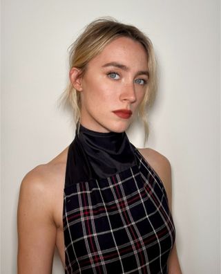 Saoirse Ronan with brick toned red lipstick