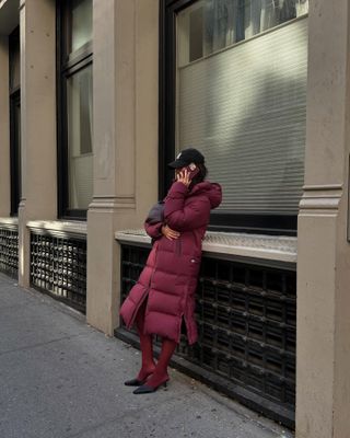 Fashion influencer @mimixn in New York City wearing a chic winter outfit styled with a puffer jacket.