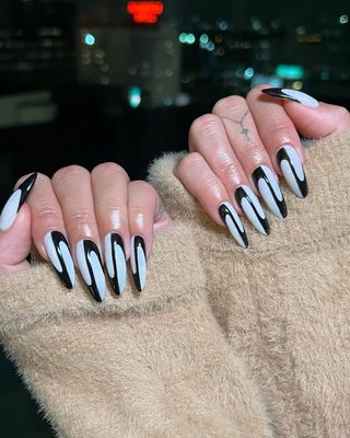 Twisted black and white manicure for Vanessa Hudgens by Zola Ganzorigt.