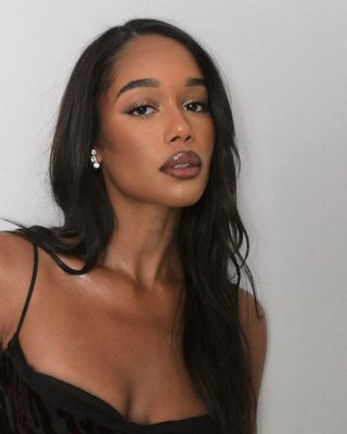 Laura Harrier wearing brown tonal makeup